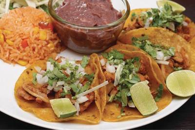 The taquitos al pastor are just like in Mexico City ที่ ร้านอาหาร Tacos & Salsa