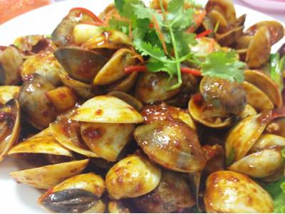 หอยตลับผัดพริก รสจัดจ้าน ที่ ร้านอาหาร Famous Singapore Seafood Restaurant
