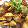 หอยตลับผัดพริก รสจัดจ้าน ที่ ร้านอาหาร Famous Singapore Seafood Restaurant