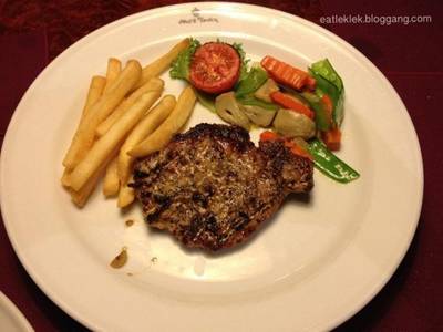 Grilled Pork Loin with Spicy Herb ที่ ร้านอาหาร Neil's Tavern Restaurant (Steak House) ร่วมฤดี
